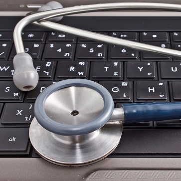 laptop computer and stethoscope